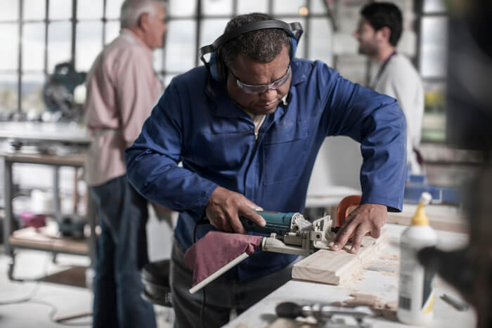 carpenter-using-sander-in-wood-workshop-2024-11-03-03-41-07-utc (1) (1)